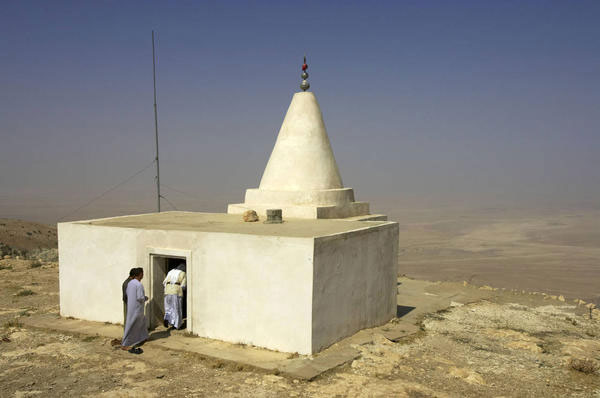Yezidi men enter a shrine at the top of Mount Sinjar, 250 miles (404 kilometers) northwest of Baghdad, Iraq, Sunday, Sept. 18, 2005. (Jacob Silberberg, AP)